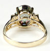 R123, 4.5ct Mystic Fire Topaz set in a Gold Ring w/ 4 cz accents