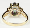R244, 6ct Mystic Fire Topaz set in a Gold Ring w/ 4 cz accents